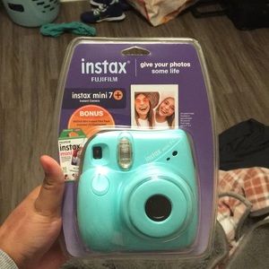 Light Blue-ish / teal Instax Camera
